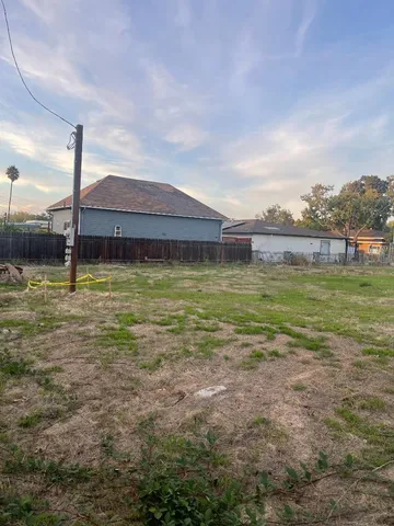 a view of a large pool with a yard