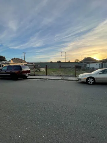 a view of street with parked cars
