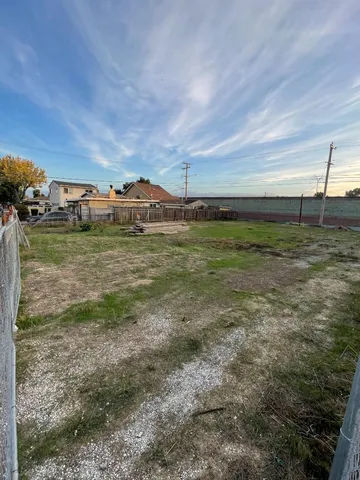 a view of a field with an outdoor space