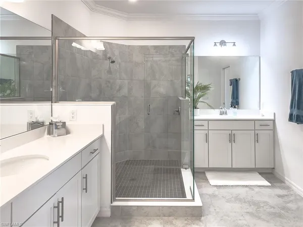 a bathroom with a granite countertop sink a toilet and a mirror