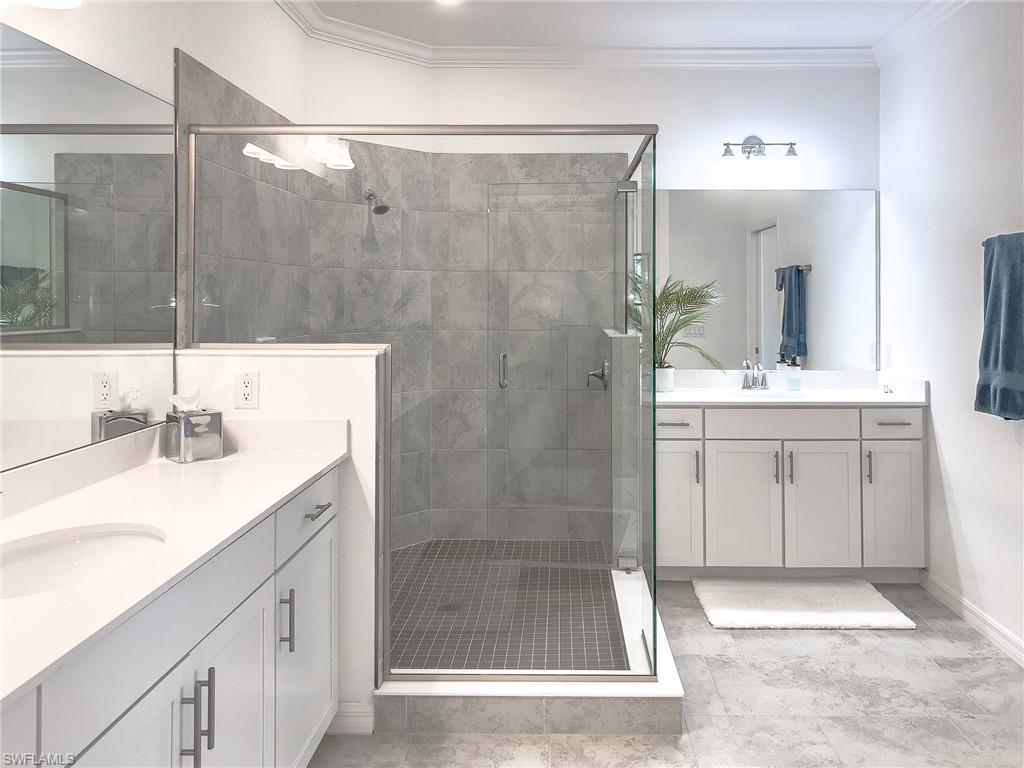 6012 Ellerston Way Avenue, Unit 1121 Immokalee, FL 34142 - Photo 16 of 50 a bathroom with a sink shower and a mirror