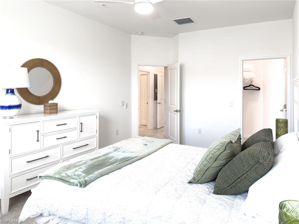 6012 Ellerston Way Avenue, Unit 1121 Immokalee, FL 34142 - Photo 19 of 50 a bedroom with a bed and a dresser