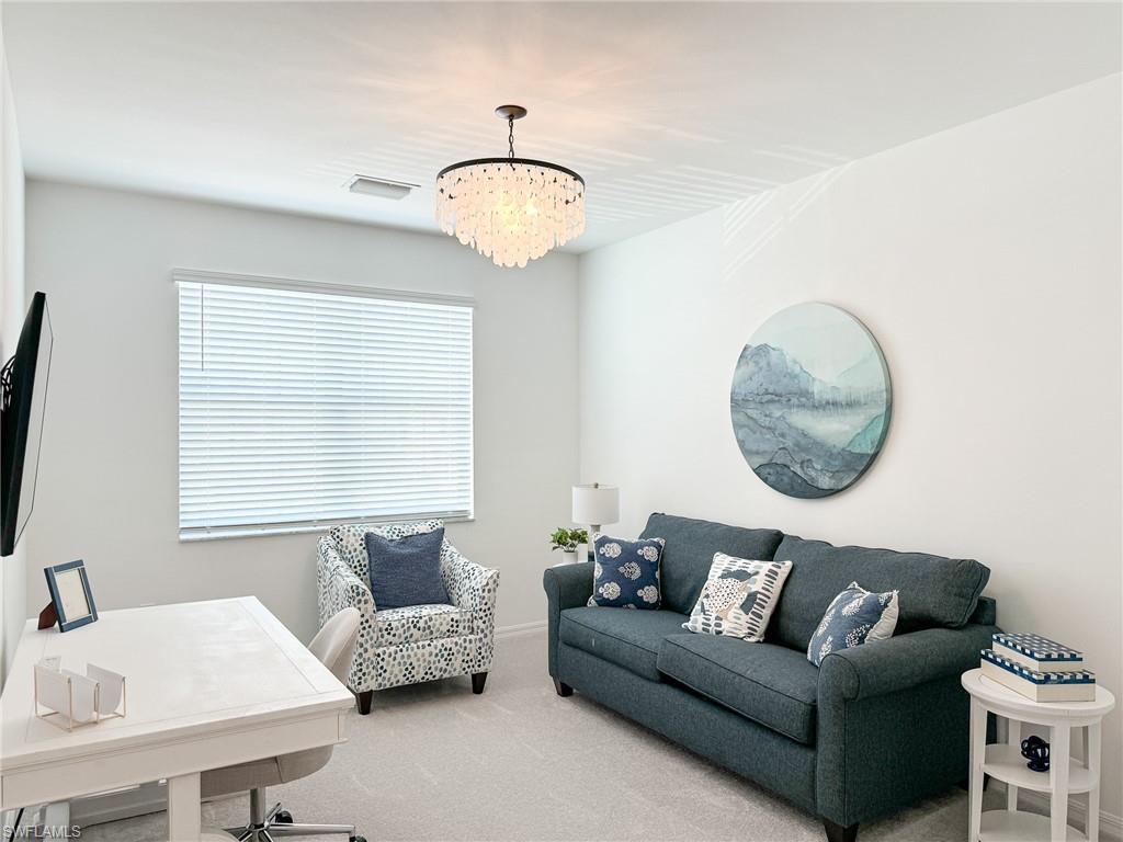 6012 Ellerston Way Avenue, Unit 1121 Immokalee, FL 34142 - Photo 20 of 50 a living room with furniture and a large window