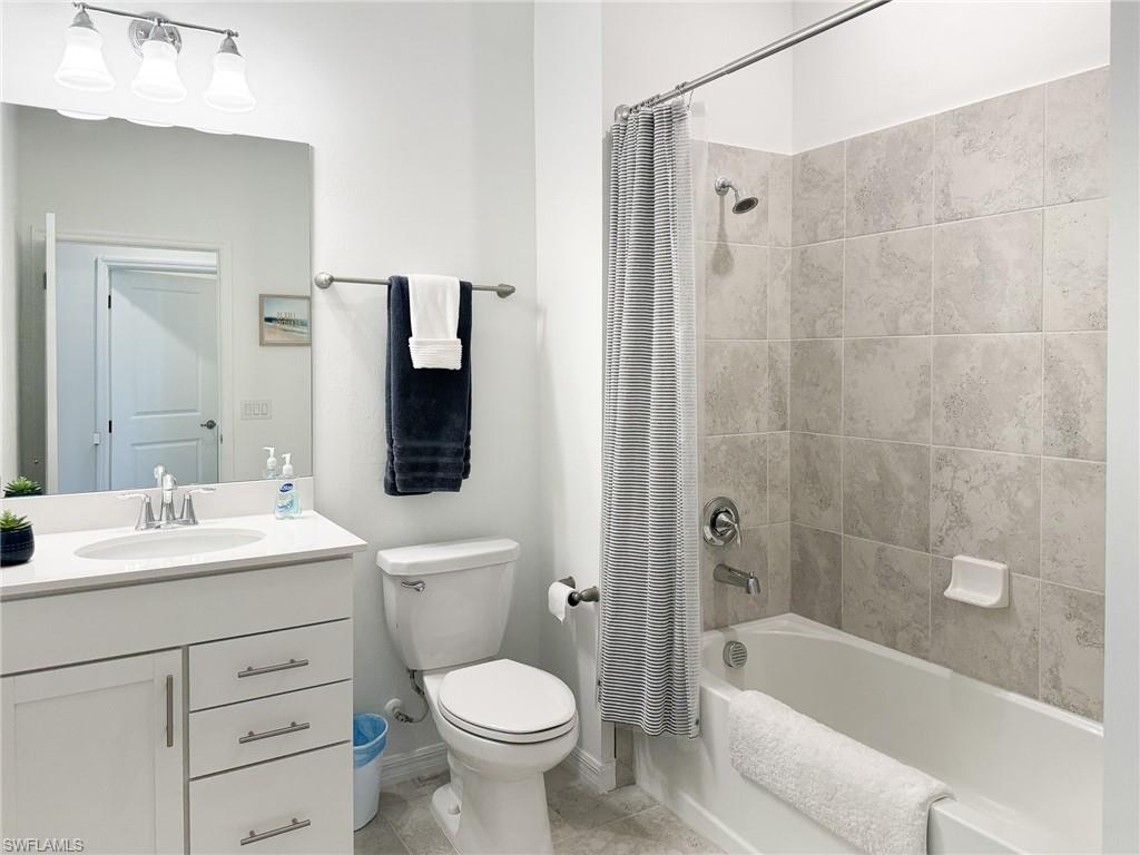 6012 Ellerston Way Avenue, Unit 1121 Immokalee, FL 34142 - Photo 22 of 50 a bathroom with a sink a toilet and shower