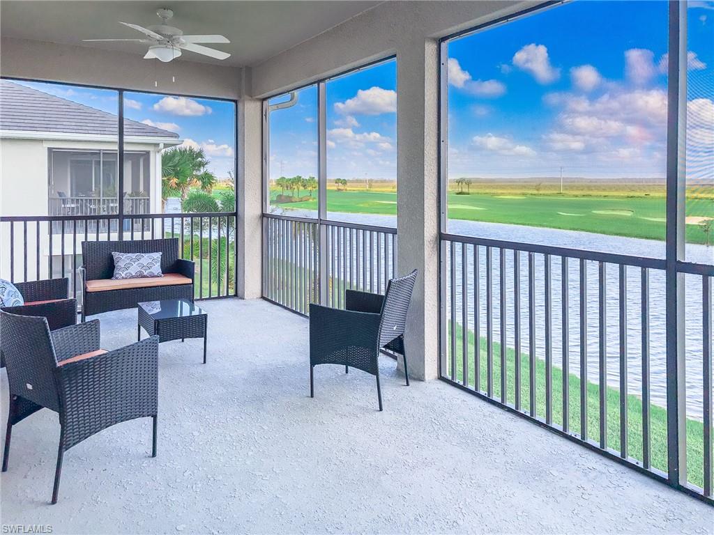 6012 Ellerston Way Avenue, Unit 1121 Immokalee, FL 34142 - Photo 25 of 50 a view of a porch with furniture and a yard
