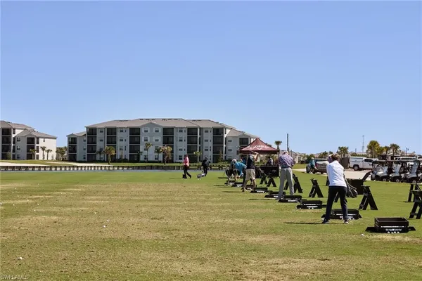 a view of a green field with clear sky