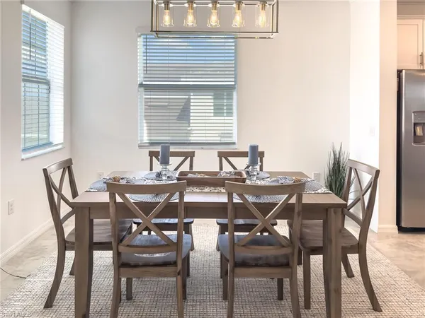 a kitchen with a sink stainless steel appliances and white cabinets