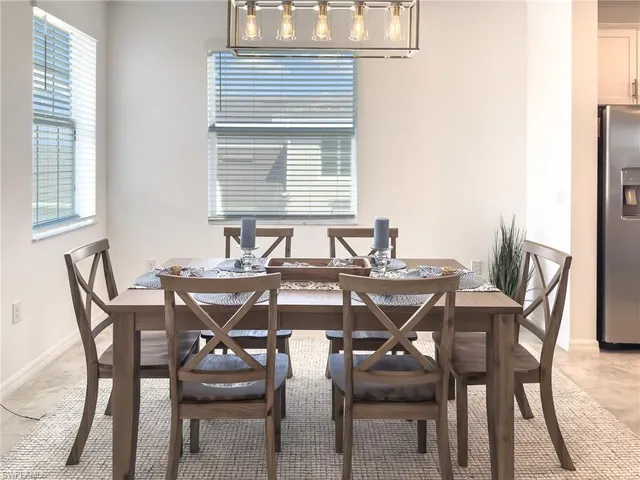 a kitchen with a sink stainless steel appliances and white cabinets