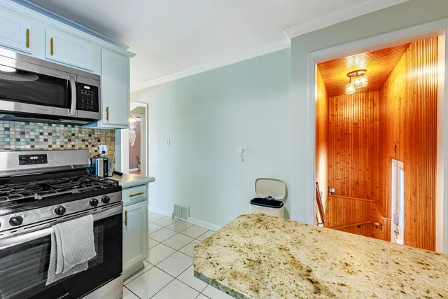 a kitchen with a stove and a microwave