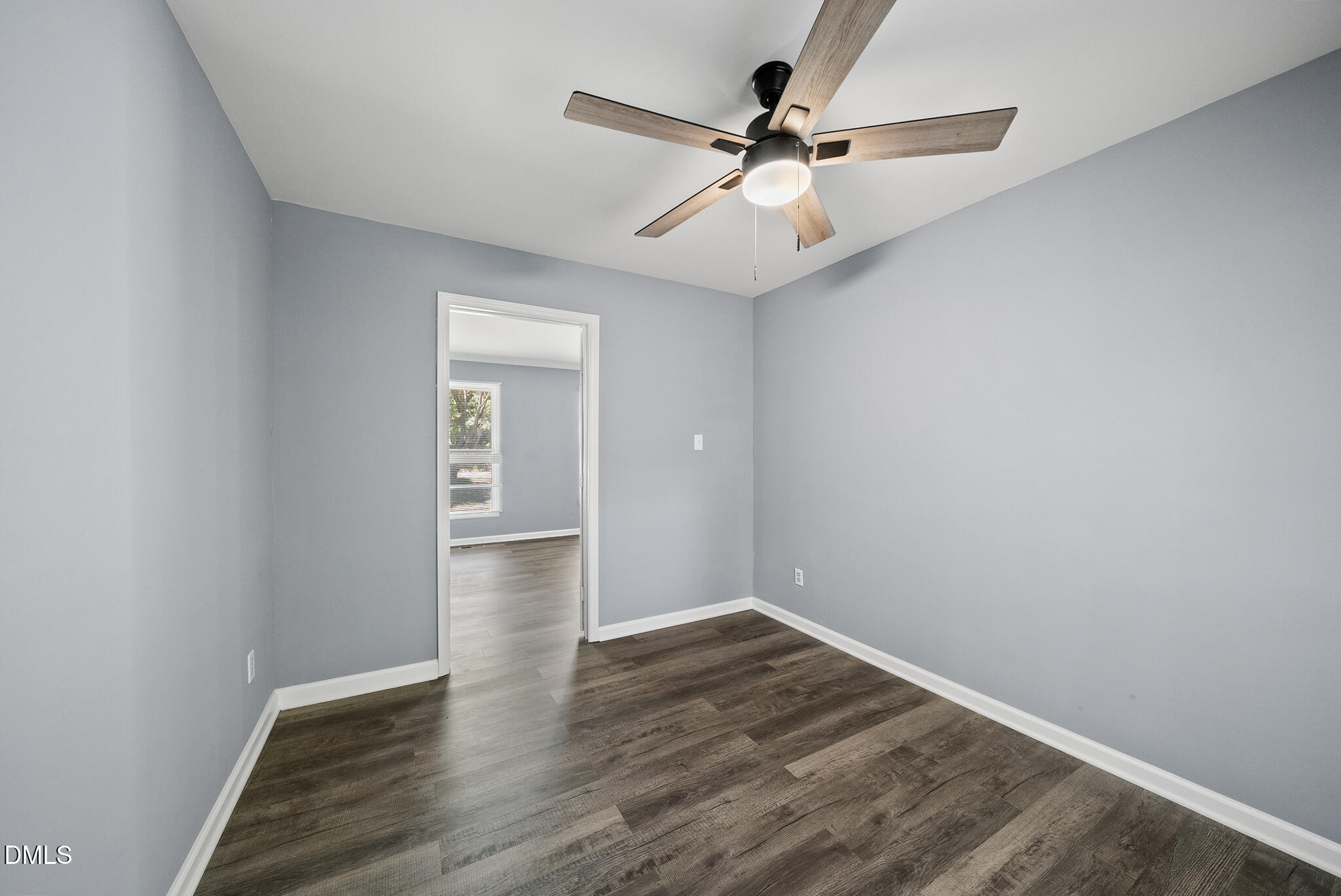 2108 Treverton Place Raleigh, NC 27609 - Photo 13 of 30 an empty room with wooden floor and windows
