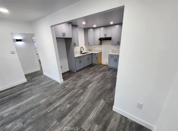 a view of a kitchen from the hallway
