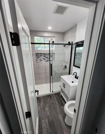 a bathroom with a tub and a shower
