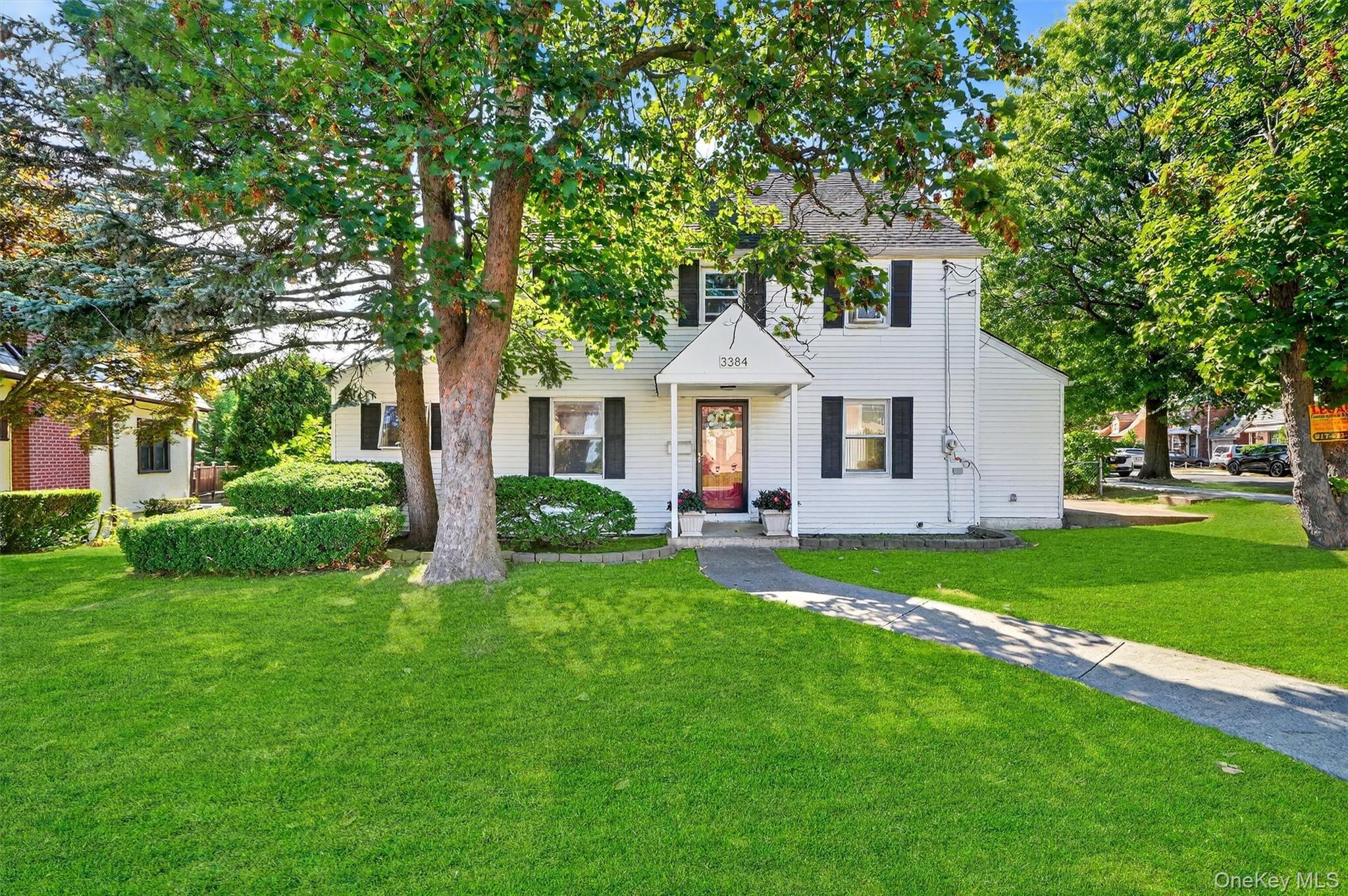 3384 Country Club Road Bronx, NY 10465 - Photo 1 of 48 Colonial inspired home with a front yard