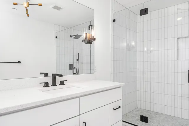 a bathroom with a sink and a shower