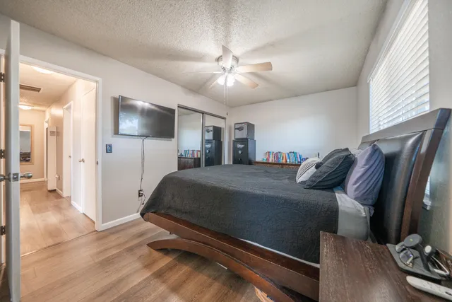 a bed room with a bed and a television