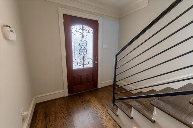a view of an entryway with wooden floor