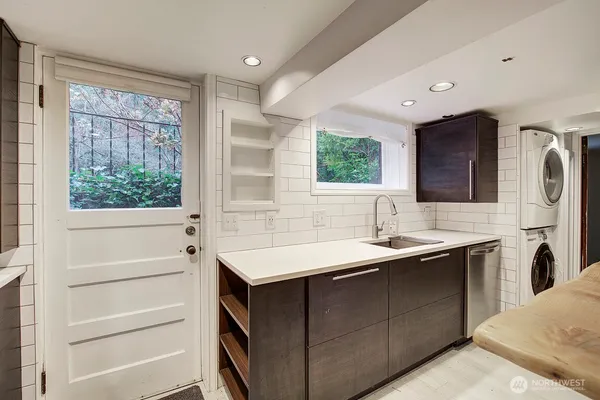 a kitchen with a sink and a refrigerator