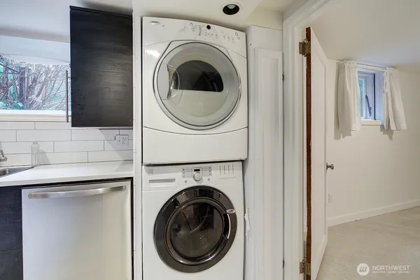 a view of a hallway with washer and dryer