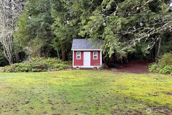 a backyard of a house with lots of green space