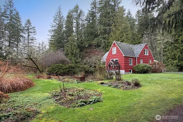 a view of house with yard and green space