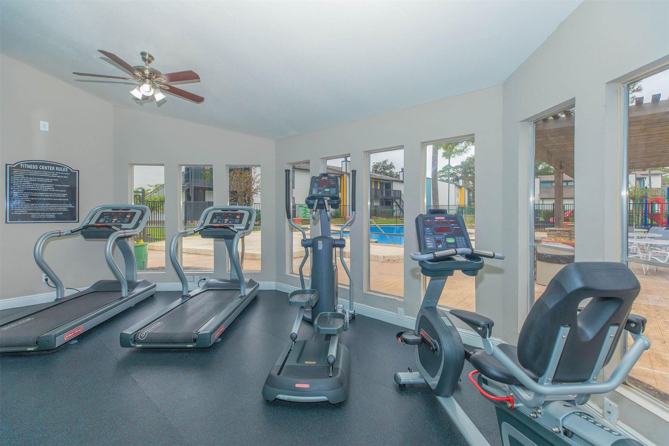 21717 Inverness Forest Boulevard, Unit 705 Houston, TX 77073 - Photo 12 of 29 a view of a room with gym equipment