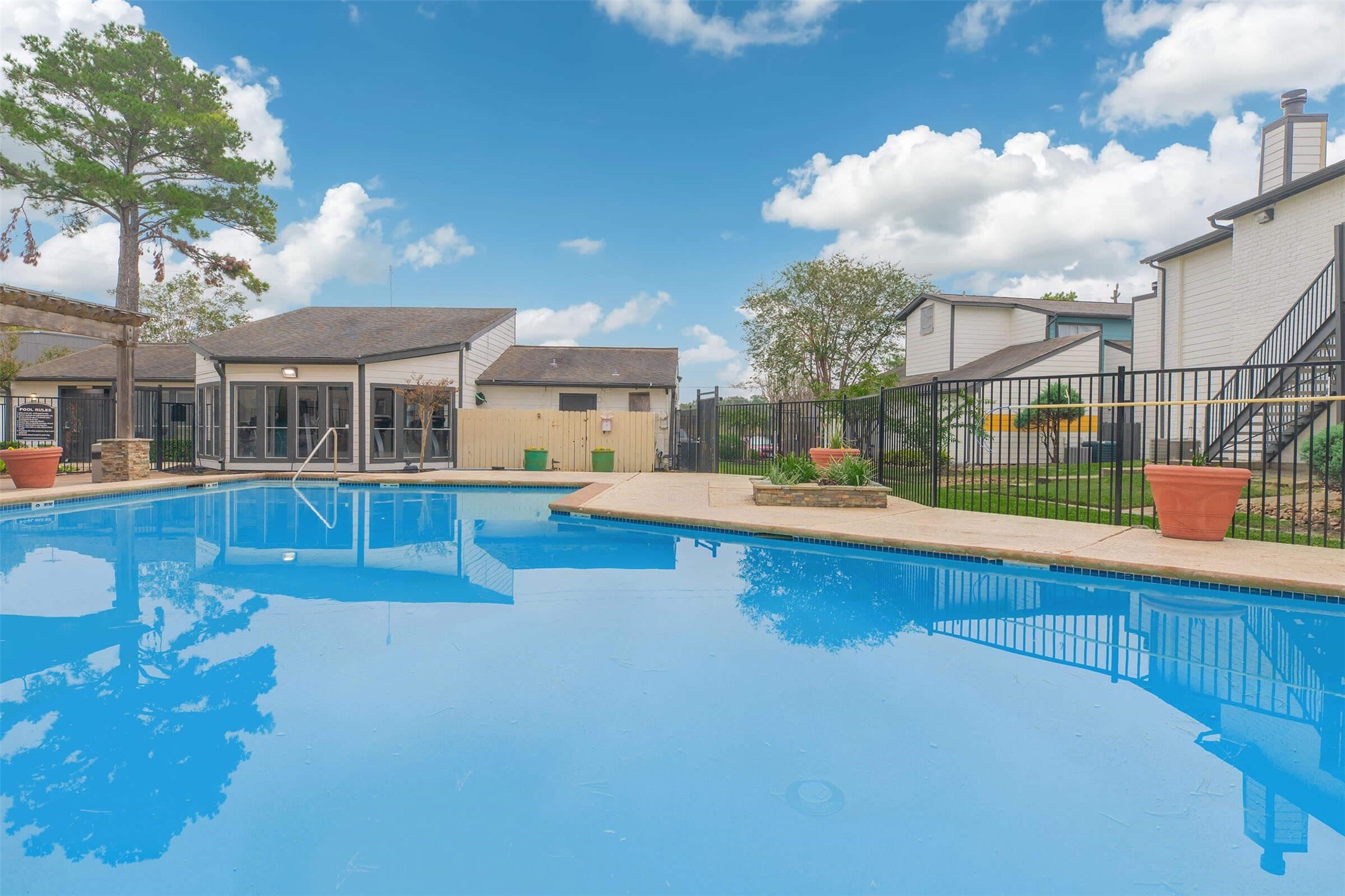 21717 Inverness Forest Boulevard, Unit 705 Houston, TX 77073 - Photo 27 of 29 a view of a swimming pool with a patio