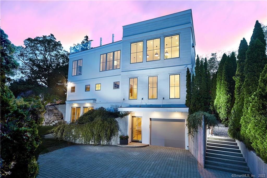206 Hillspoint Road Westport, CT 06880 - Photo 1 of 1 a front view of a house with a yard