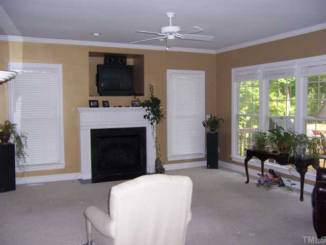 12708 Amoretto Way Raleigh, NC 27613 - Photo 8 of 12 Large family room with gas log fireplace.