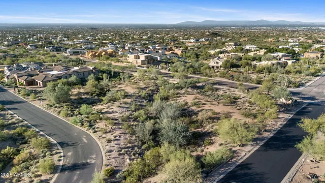 an aerial view of residential building and trees around