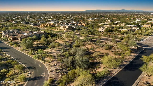 a view of a mountain range with trees in the background