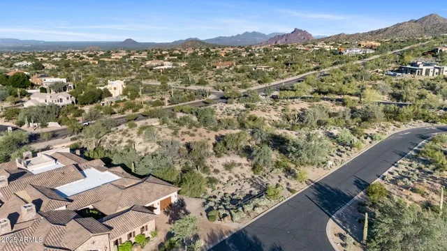 a view of a city with mountains in the background