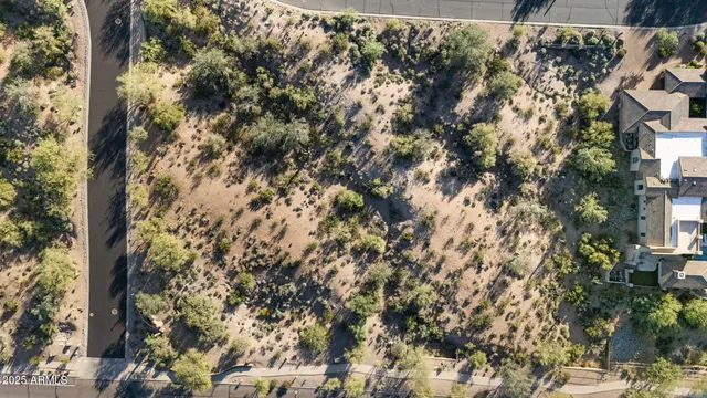 a view of a large building with a mountain in the background