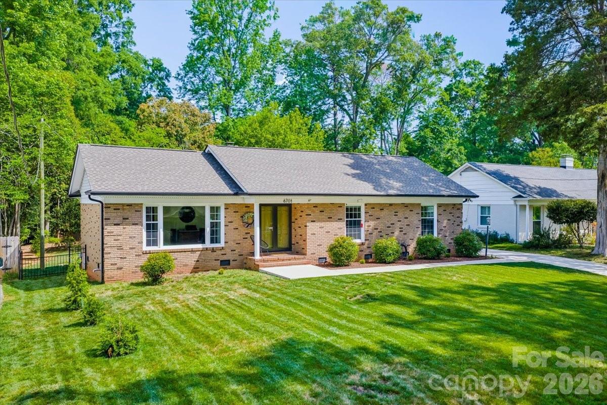 6701 Ronda Avenue Charlotte, NC 28211 - Photo 1 of 46 a front view of a house with a yard