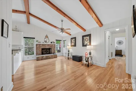 a view of a livingroom with a fireplace and furniture