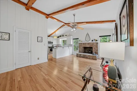 a view of a livingroom with furniture and a fireplace
