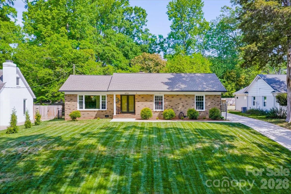 6701 Ronda Avenue Charlotte, NC 28211 - Photo 2 of 46 a front view of a house with garden