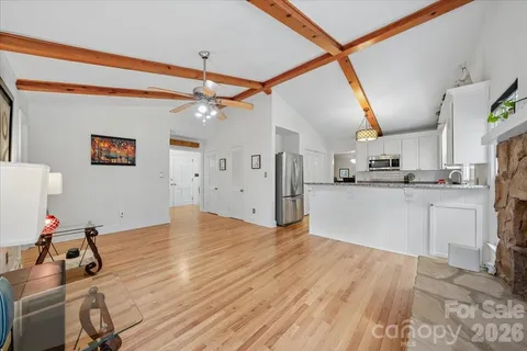 a view of a kitchen with wooden floor