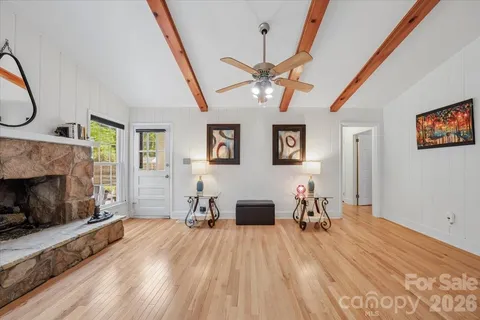 a view of a livingroom with furniture and a fireplace