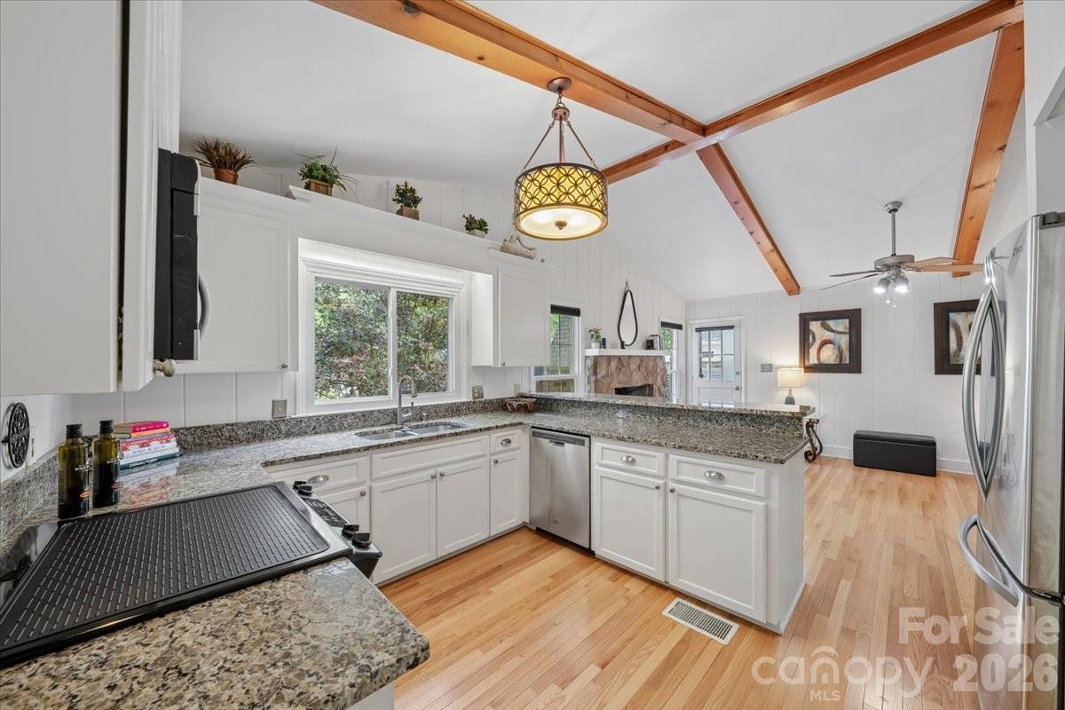 6701 Ronda Avenue Charlotte, NC 28211 - Photo 27 of 46 a kitchen with a sink cabinets and window