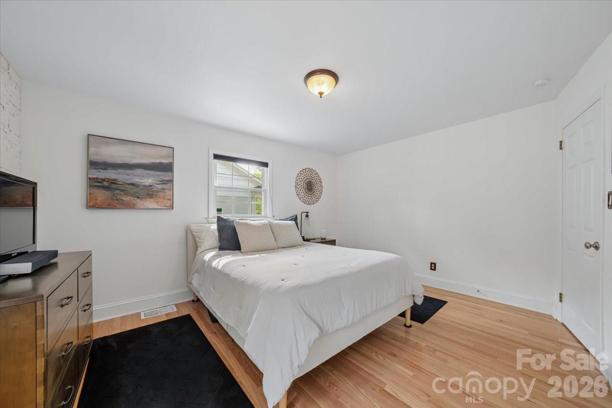 6701 Ronda Avenue Charlotte, NC 28211 - Photo 31 of 46 a bedroom with a bed and a window