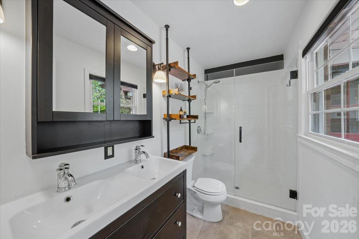 6701 Ronda Avenue Charlotte, NC 28211 - Photo 33 of 46 a bathroom with a sink toilet and shower