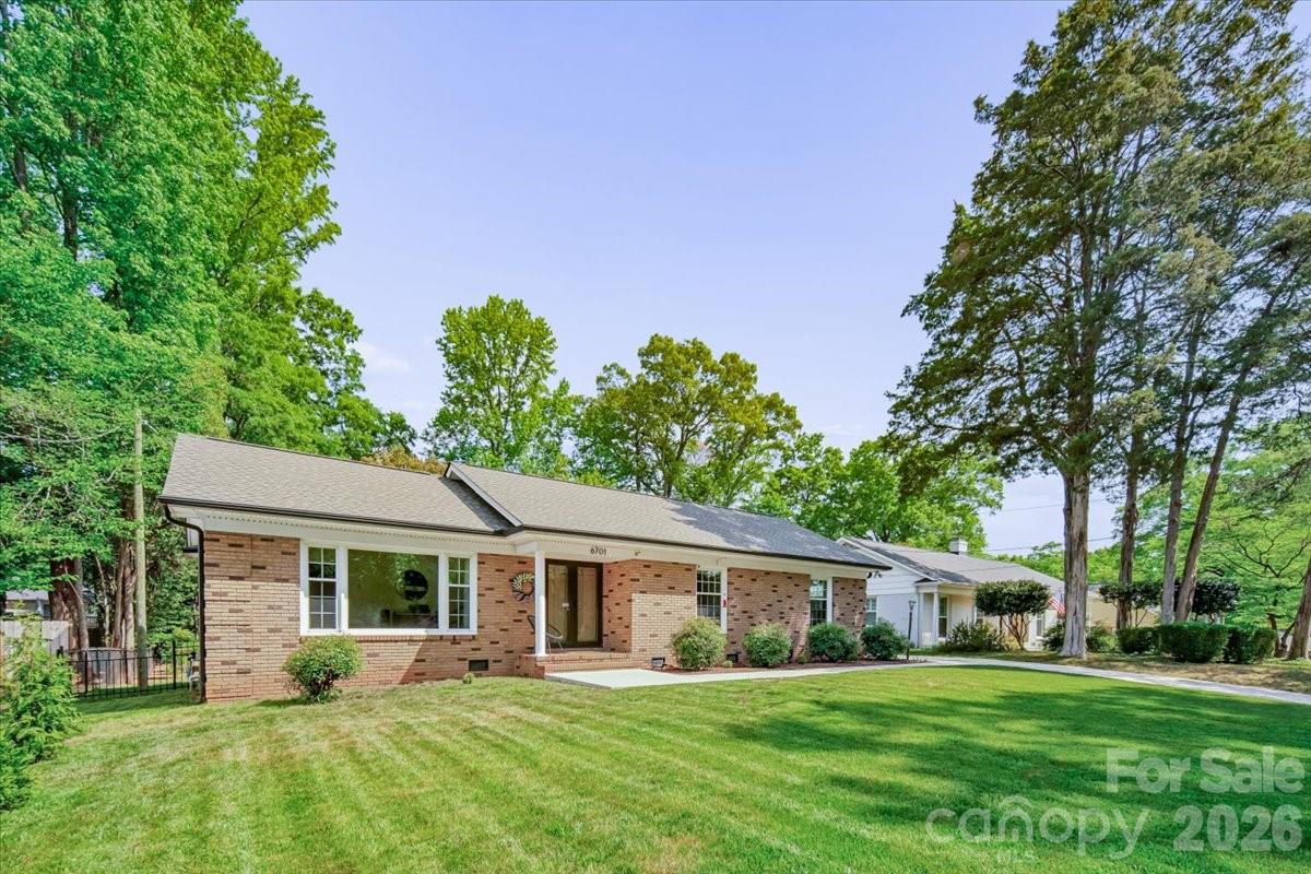 6701 Ronda Avenue Charlotte, NC 28211 - Photo 4 of 46 a front view of a house with a yard