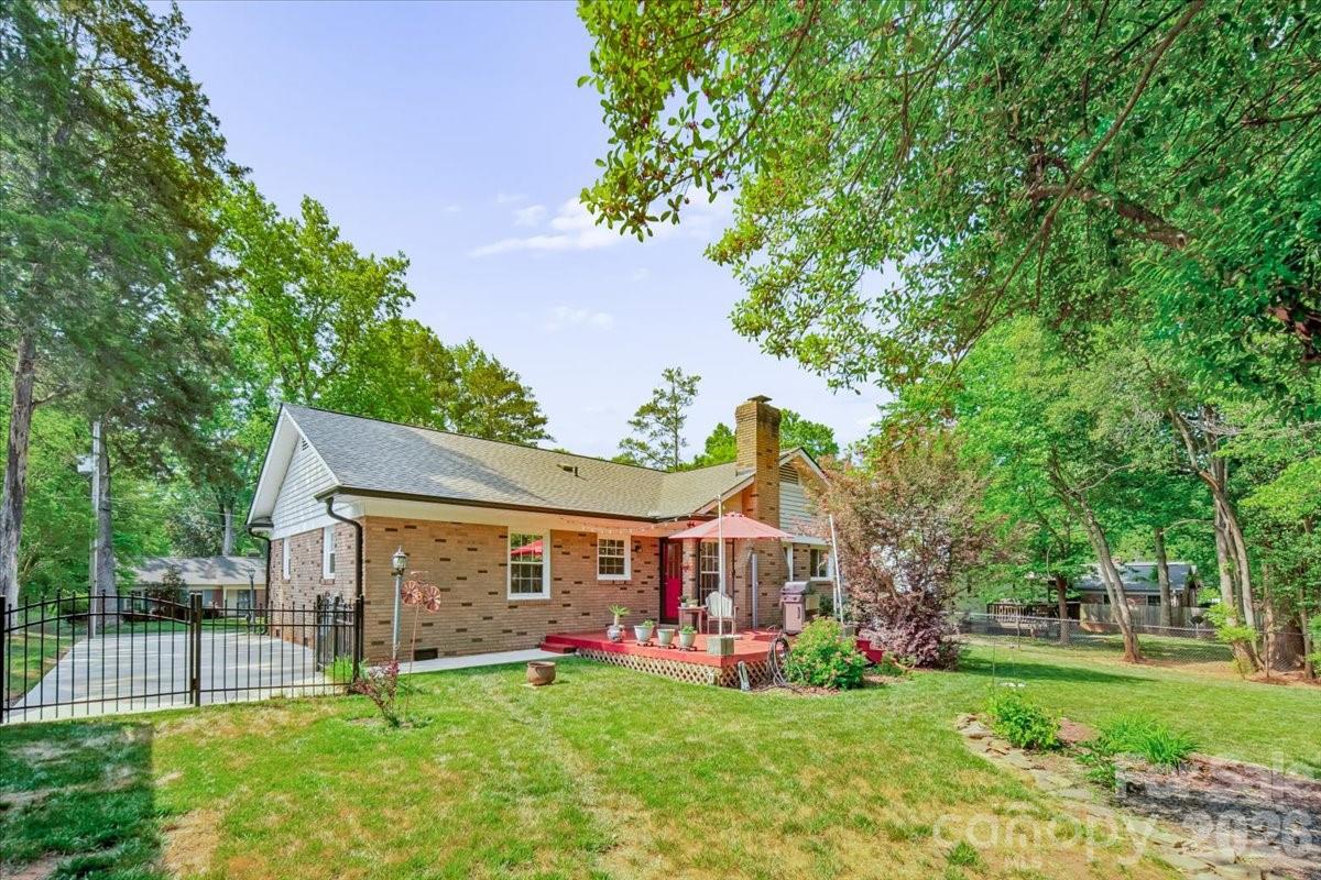 6701 Ronda Avenue Charlotte, NC 28211 - Photo 41 of 46 a view of a house with a yard and sitting area