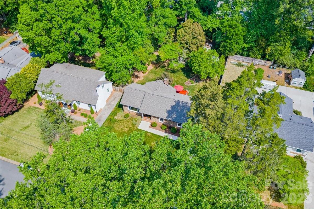 6701 Ronda Avenue Charlotte, NC 28211 - Photo 44 of 46 an aerial view of a house with a yard and outdoor seating