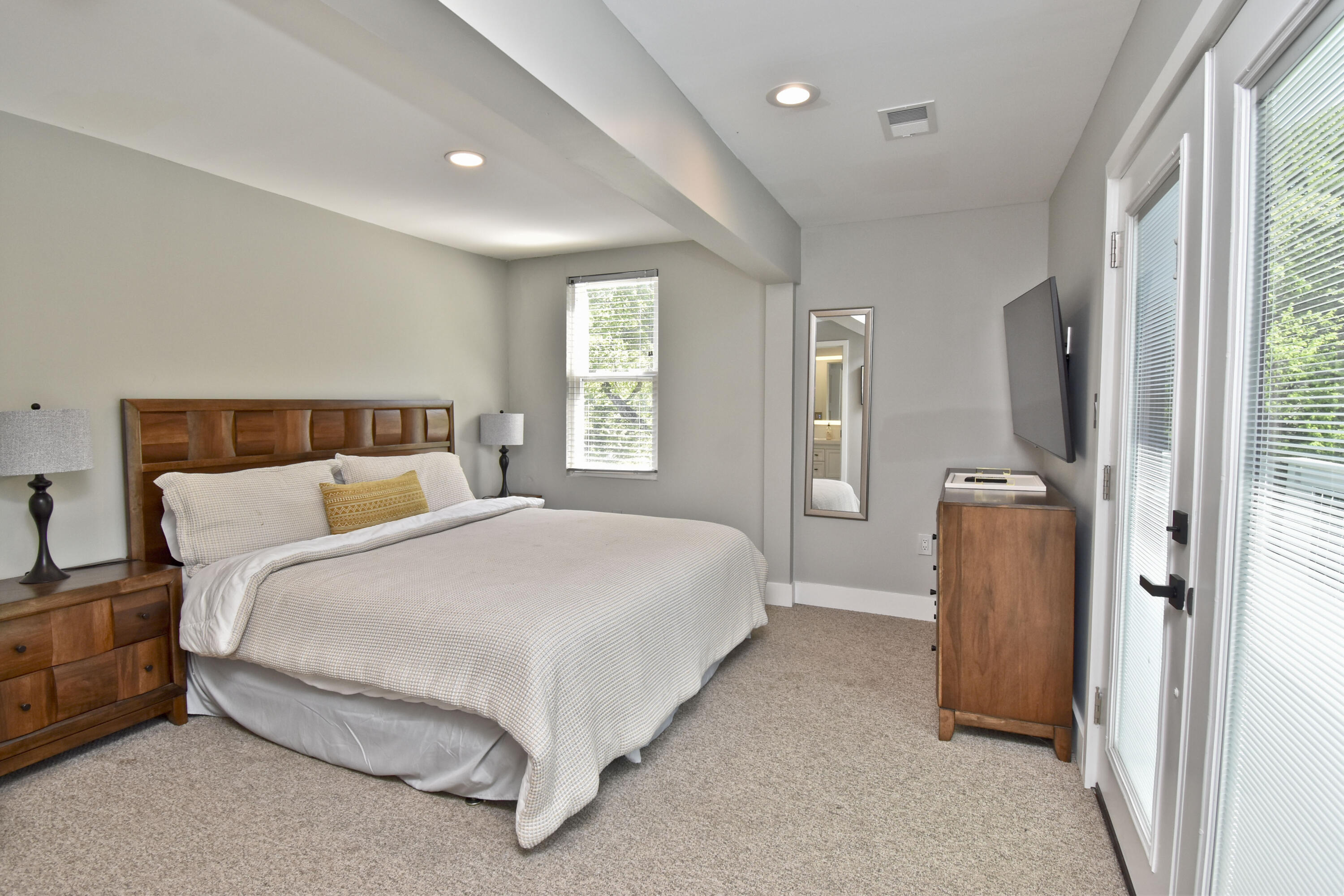 1104 Buttermilk Falls Road East Stroudsburg, PA 18301 - Photo 35 of 73 a spacious bedroom with a bed and a window