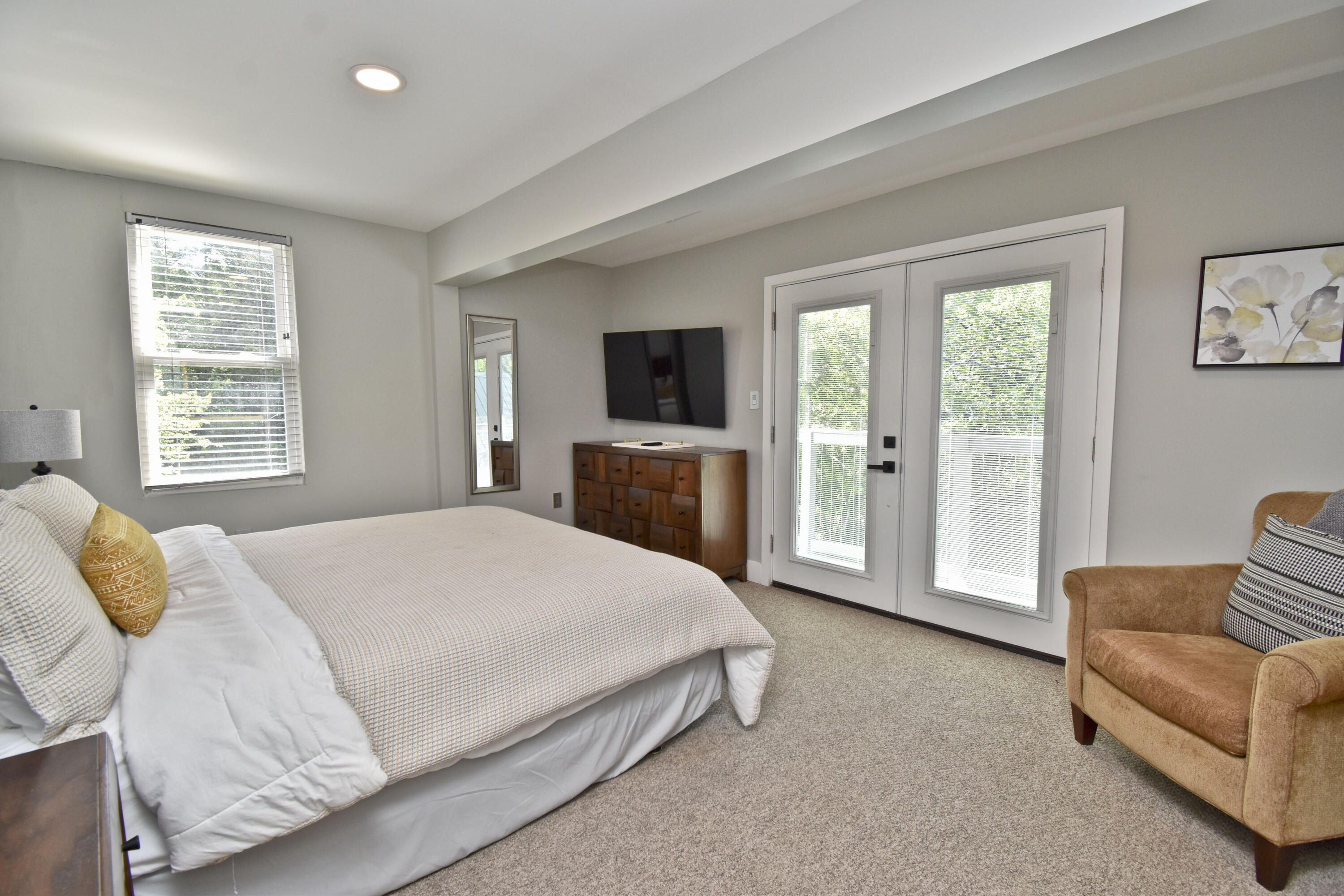 1104 Buttermilk Falls Road East Stroudsburg, PA 18301 - Photo 36 of 73 a spacious bedroom with a large bed and a flat tv screen