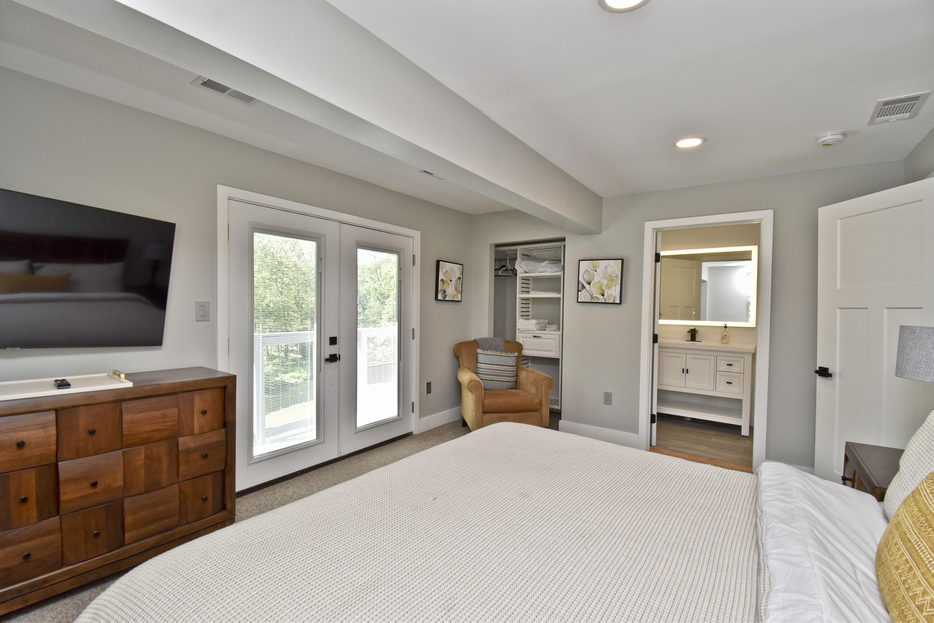 1104 Buttermilk Falls Road East Stroudsburg, PA 18301 - Photo 37 of 73 a bedroom with furniture and a flat screen tv