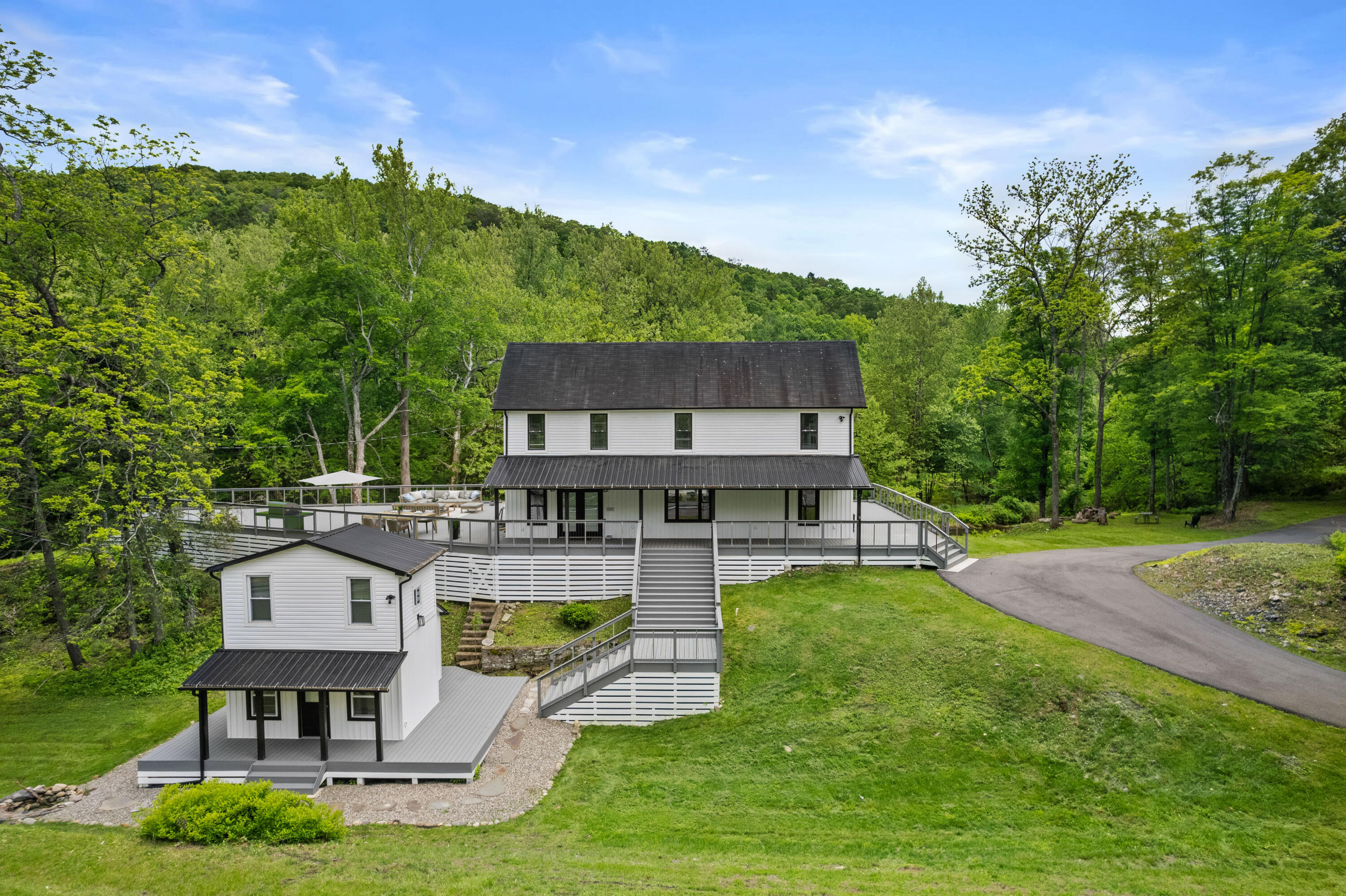 1104 Buttermilk Falls Road East Stroudsburg, PA 18301 - Photo 68 of 73 an aerial view of a house with swimming pool garden and patio