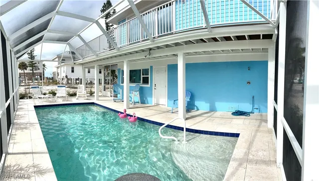 a view of a living room and kitchen