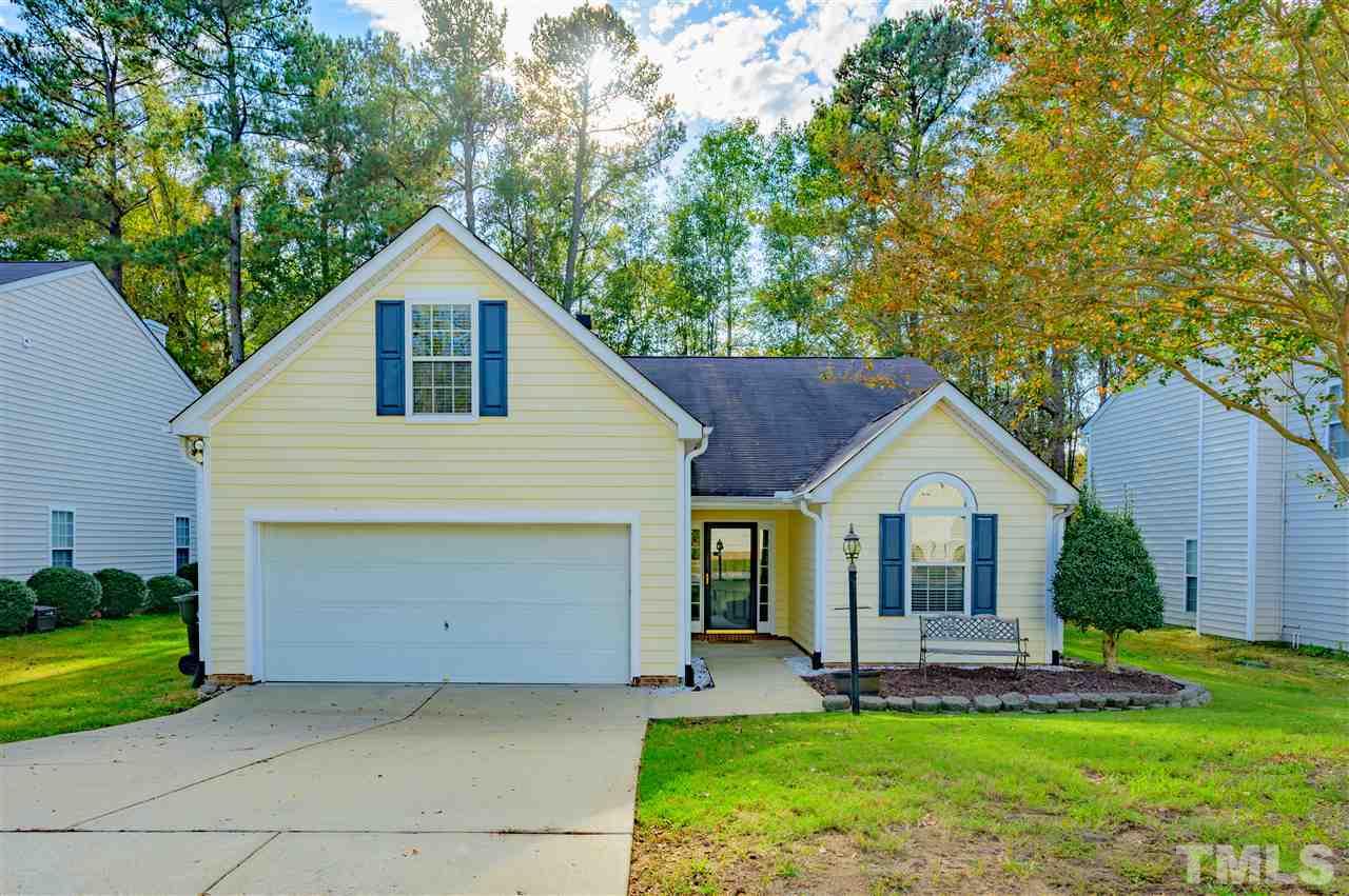 4520 Drewbridge Way Raleigh, NC 27604 - Photo 1 of 22 a front view of a house with a yard and garage